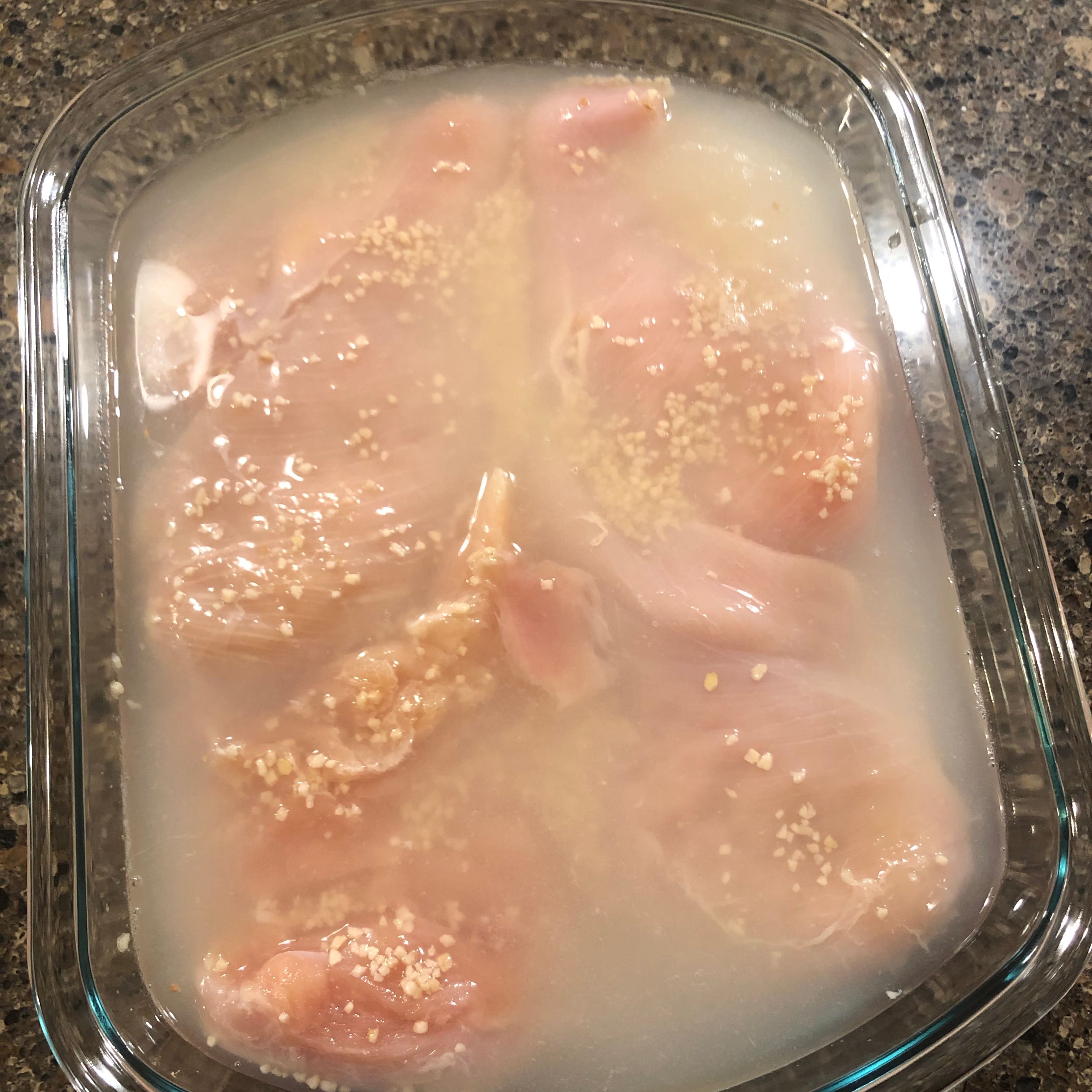 preparing raw chicken breasts